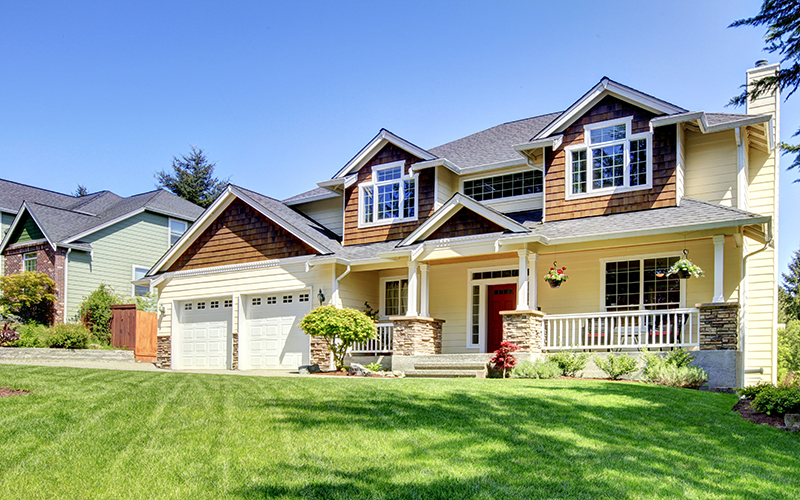 Large American beautiful house with red door. Pre-Sellers Home Inspection Services